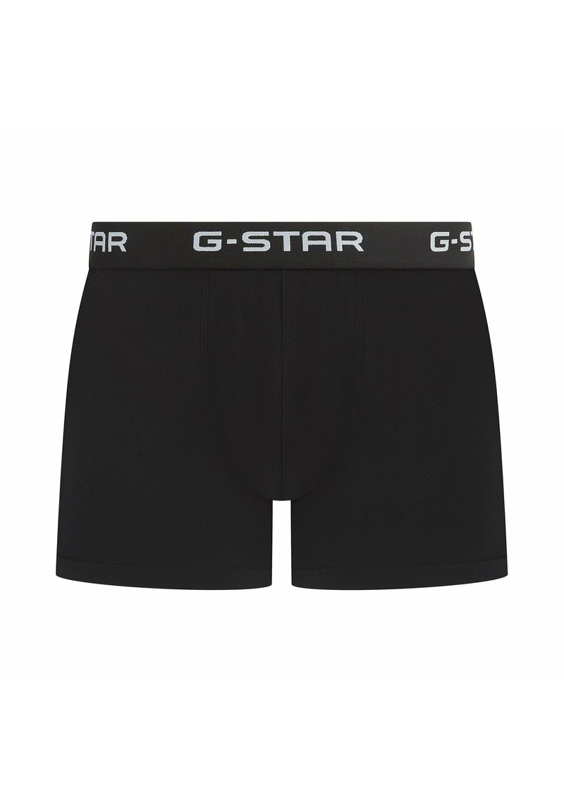 Boxers noirs en tissu doux, offrant une coupe ajustée, une ceinture élastique avec le logo G-STAR en blanc, et des coutures minimales pour plus de confort.