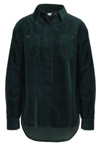 Camicia in corduroy verde scuro con colletto a camicia, due taschini sul petto e polsini a coste; presenta un orlo posteriore più lungo per un fit oversize.