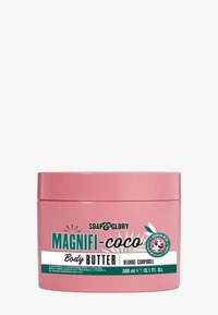 Pot rose avec un couvercle à vis, étiqueté "SOAP & GLORY MAGNIFI-coco Beurre Corporel." Contient 300 ml. Présente des graphiques tropicaux et des accents de couleur.