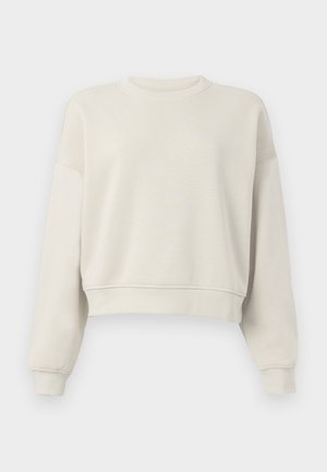Lichtbeige cropped sweatshirt met lange mouwen, geribde kraag en manchetten, zachte stofstructuur, minimalistisch design, geen zichtbare patronen of accenten.