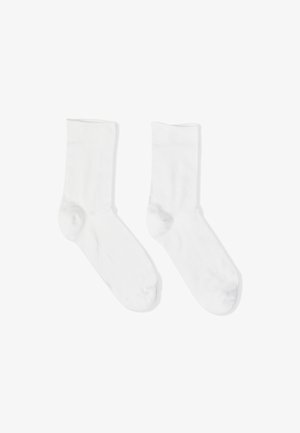 White cotton socks with a smooth texture, crew length, and reinforced toe. No patterns or accents. Suitable for casual wear.