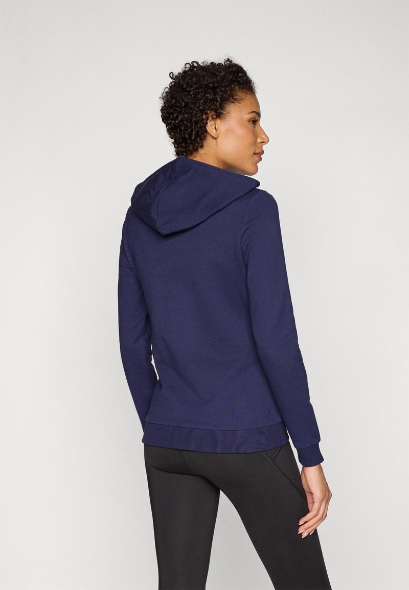 Felpa con cappuccio blu navy in tessuto strutturato, con polsini e vita a costine, caratterizzata da un design semplice e vista posteriore.