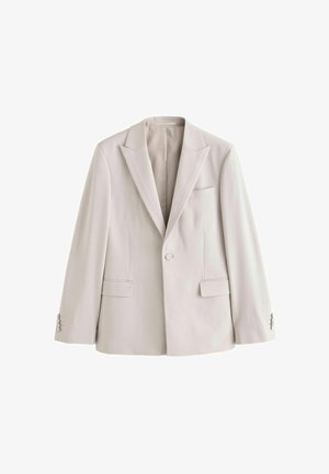Világosszürke blézer sima anyagból, hajtókás gallérral, egysoros gombolással, két elülső zsebbel és gombbal záródó mandzsettákkal.