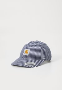 Striped navy blue cap with an adjustable brim and a yellow logo patch. Features vertical white stripes and soft fabric texture.