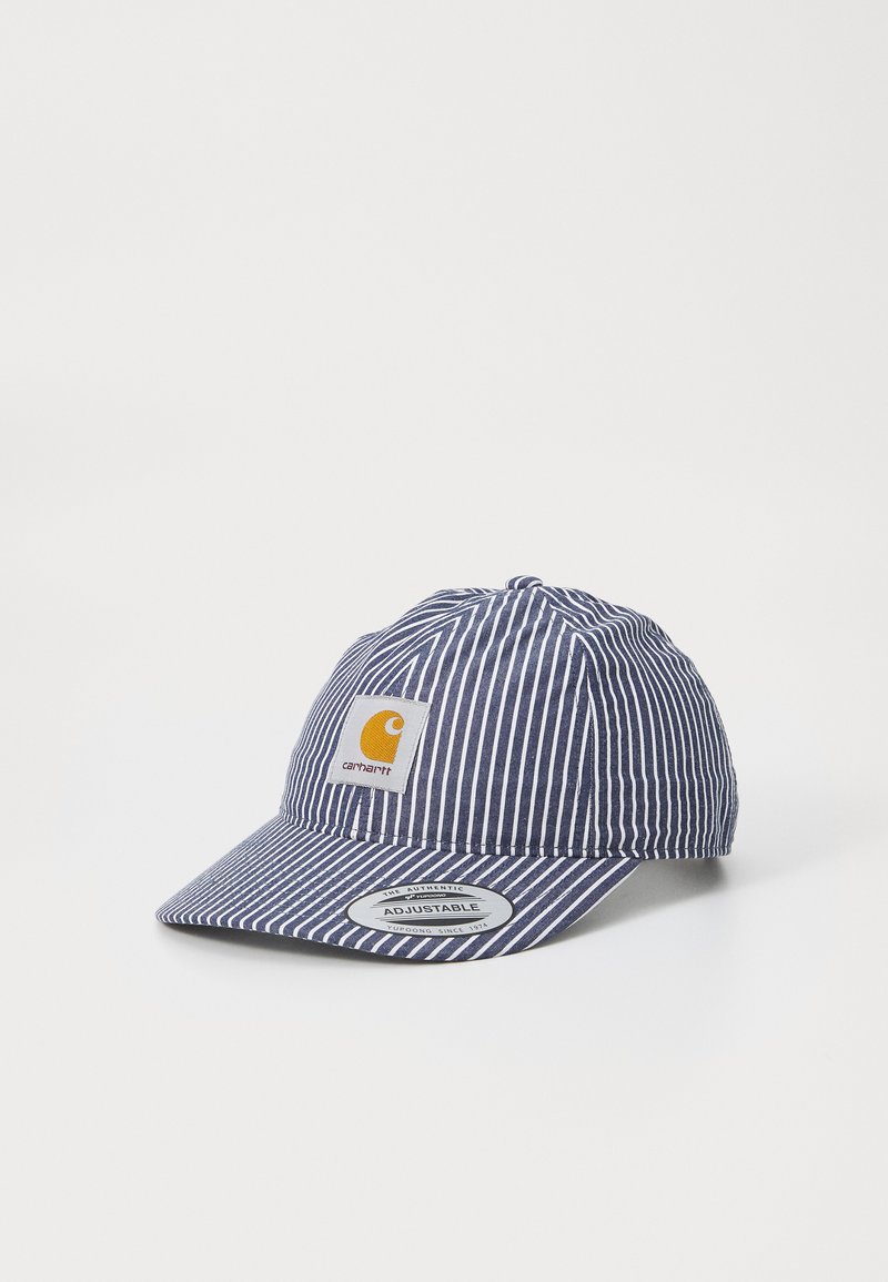 Striped navy blue cap with an adjustable brim and a yellow logo patch. Features vertical white stripes and soft fabric texture.