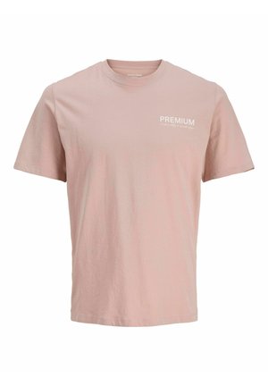 Helles rosa T-Shirt mit kurzen Ärmeln, aus weichem Baumwollstoff. Verfügt über ein weißes "PREMIUM"-Logo auf der linken Brust. Einfaches, klassisches Design.