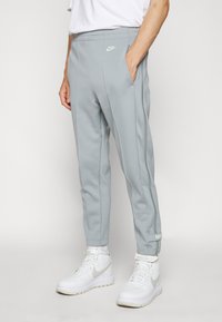 Nike Sportswear CIRCA PANT - Träningsbyxor - particle grey/coconut milk
