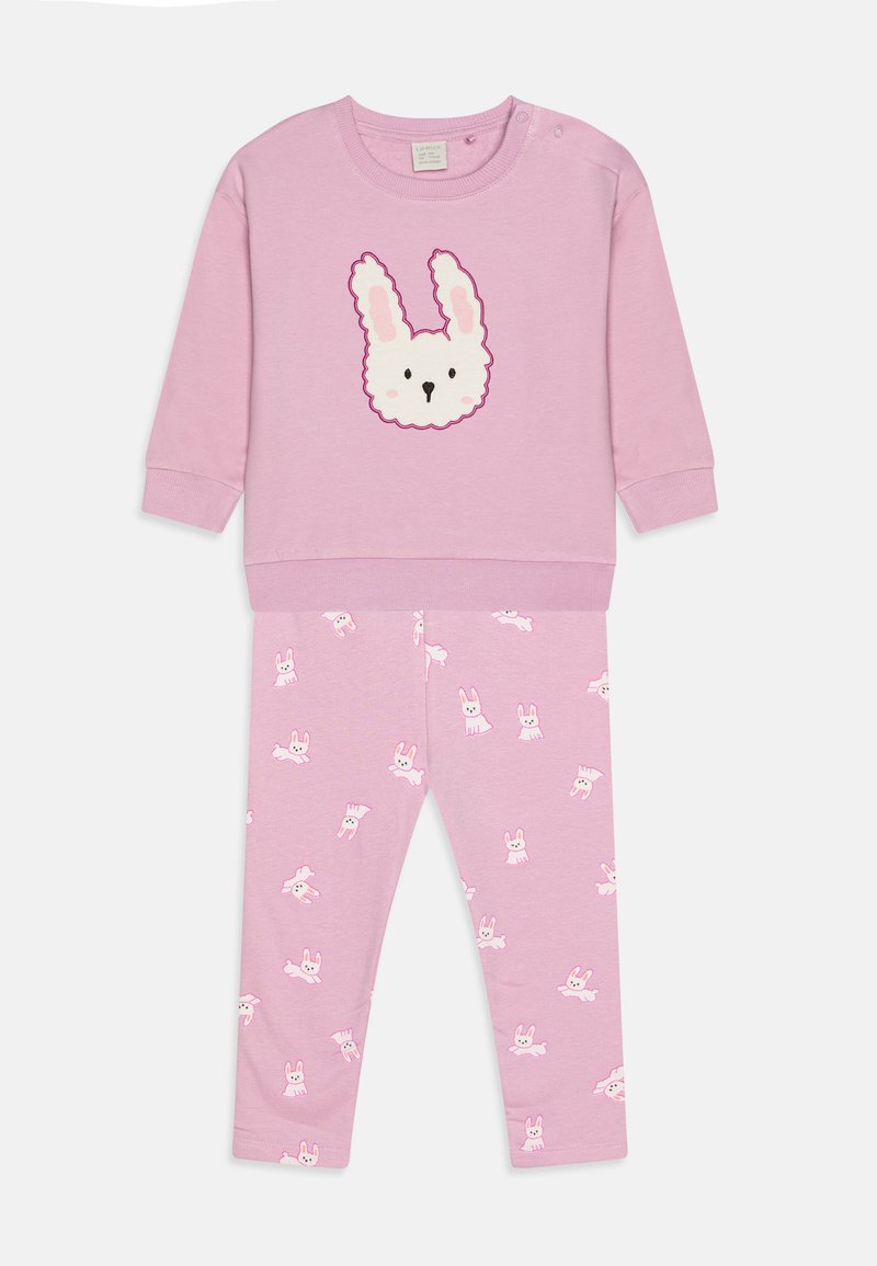 Pink cotton tracksuit featuring a long-sleeve top with a white bunny face and pink-accented leggings with a repeated bunny pattern.