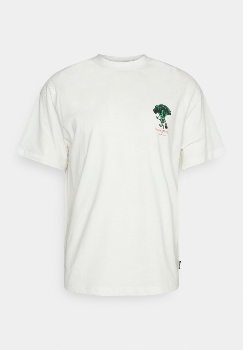 White cotton t-shirt featuring a green broccoli graphic with text “des légume” in red, short sleeves, and a relaxed fit design.