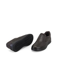 Schwarze Leder-Slipper mit glatter Oberfläche, runder Kappe und strukturiertem Gummisole mit Zickzackmuster für besseren Halt.