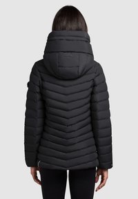 Black puffer jacket with a chevron pattern, high collar, and attached hood. Features zip closure and elastic cuffs. Smooth texture.