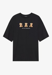 Black short-sleeve t-shirt featuring three plush teddy bears above the text "NOT MY PROBLEM" in white, with a relaxed fit and soft texture.