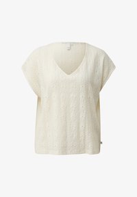 Top de punto de manga corta color crema con escote en V y patrón de cable trenzado floral, con un ajuste holgado y una pequeña etiqueta de la marca en el dobladillo.