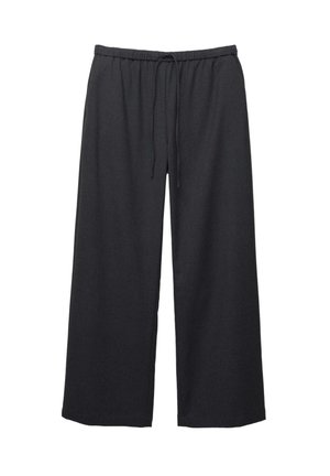 Pantalons larges noirs avec une taille élastique et un cordon de serrage. Fabriqués en tissu tissé avec une texture lisse. Sans poches.