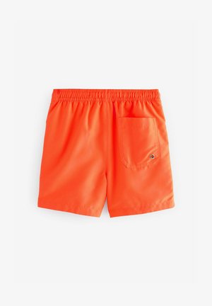 Oranžie peldbikši ar elastīgu jostasvadu, ar aizmugures kabatu un gludu, spīdīgu tekstūru. Vienkāršs, vienkrāsains dizains.