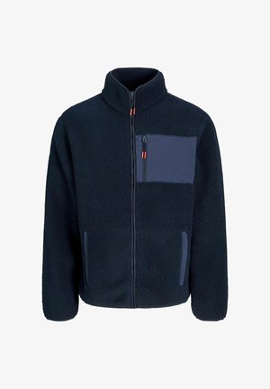 Tumes fleece-svete, millel on kõrge kaelus, lukuga ees, üks rinnatasku ja kaks küljetaskut, millel on siledad kangast aktsendid ja punased lukutatavad kangid.