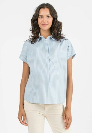 Light blue short-sleeve blouse with vertical white stripes, a button-down collar, and a relaxed fit. Smooth fabric with subtle sheen.