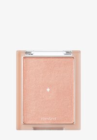 Pressad highlighter i en klar fyrkantig förpackning. Har en skimrande persikofärg med en mjuk textur och en liten stjärndesign i mitten.
