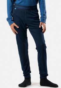 Collant termici navy con texture a coste e vita elastica, con logo "SWEDMOUNT" e piccolo dettaglio della bandiera svedese.