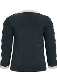 Mörkblå långärmad skjorta med crèmefärgad kant och chevron-mönstrade detaljer längs ärmarna, tillverkad av mjukt, stretchigt tyg.