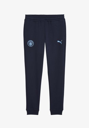 Navy blue sweatpants made of soft, stretchy fabric. Features elastic waistband, ribbed cuffs, Manchester City logo, and Puma branding.