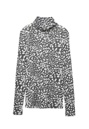 Långärmad polo i grått tyg med ett vitt abstrakt prickmönster. Har en avslappnad passform och mjuk textur.