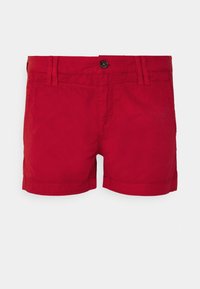 Červené bavlněné šortky s knoflíkovým zapínáním, poutky na opasek a bočními kapsami. Látka má hladkou texturu s lemovaným zakončením.