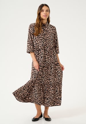 Maxi dress with a leopard print pattern, featuring a collared neckline, short sleeves, tiered skirt, and button-down front.