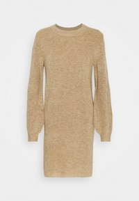 Vaaleanruskea neulottu vuodetanssi, jossa on pyöreä pääntie, pitkät pallotunnus hihat ja teksturoitu pinta. Yksinkertainen ja suora leikkaus.