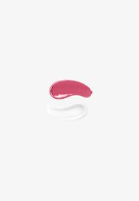 Due colori di campioni di crema: uno lucido rosa acceso e uno bianco opaco, entrambi con texture lisce e spesse su uno sfondo bianco semplice.