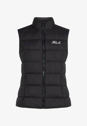 Gilet rembourré noir avec un col montant, un quilting vertical, une fermeture éclair à l'avant et un petit logo brodé sur la poitrine gauche.