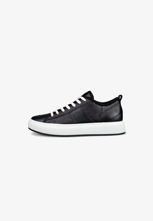 Black leather sneaker with textured surface, white laces, and a thick white sole. Features side perforations and a black accent near the heel.