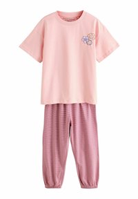 Różowa koszulka z krótkim rękawem z graficznym motywem kwiatu, połączona z spodniami w czerwono-białe paski z elastycznymi mankietami i pasem w talii. Wykonana z miękkiej bawełny.