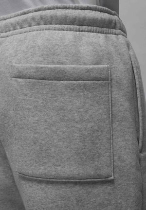 Grijze sweatpants van een gladde, gestructureerde stof met een grote, vierkante achterzak. Voorzien van een elastische tailleband voor comfort.