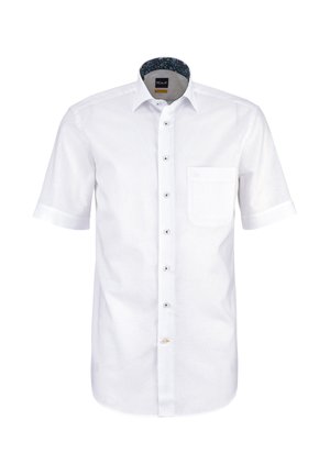 Camicia bianca a maniche corte con bottoni, taschino frontale e fodera interna del colletto floreale, mostrata su uno sfondo semplice.