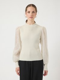 Cream-colored knit top with sheer puff sleeves, high neckline, and fitted bodice. Soft texture with a delicate floral pattern on sleeves.