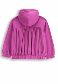 Bluza z kapturem w jasnoróżowym kolorze, z marszczonym tyłem i elastycznymi mankietami oraz dołem. Miękka tkanina o gładkiej fakturze.