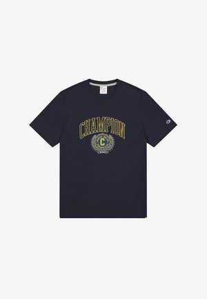 T-shirt in cotone blu navy con una grande stampa "CHAMPION" in giallo e un logo circolare con design a alloro sottostante. Maniche corte, collo a giro.
