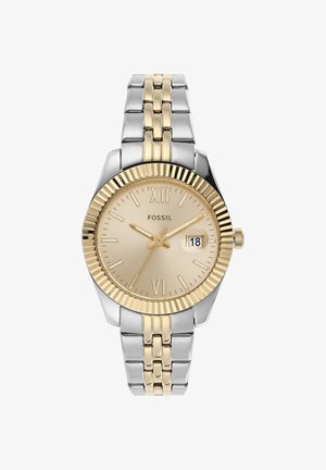 Montre-bracelet ronde bicolore or et argent Fossil affichant 10:10:36 avec une fenêtre date réglée sur 18 sur un cadran doré avec chiffres romains.