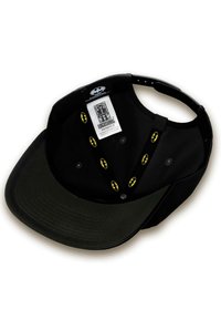 Black cap with a flat brim, featuring yellow Batman logos inside and on the adjustable strap. Textured underside and branded label visible.
