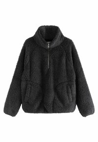 Veste noire en tissu duveteux avec col haut, demi-fermeture éclair à l'avant et deux grandes poches avant. Tissu doux et texturé avec une coupe décontractée.