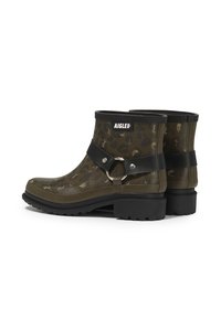 Green leopard print rubber ankle boots with black strap and silver ring detail; textured surface with a chunky, ridged sole.