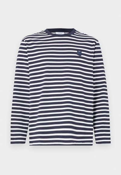Navy and white striped long-sleeve shirt with a ribbed crew neck and a small embroidered logo on the left chest. Cotton material.