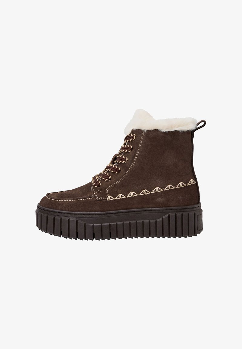 Braune Wildleder ankle boots mit einer dicken Gummisohle, ausgestattet mit beigen Nähten und einem Kragen aus Kunstfell. Mit Schnürsenkeln und einer Schlaufe auf der Rückseite.