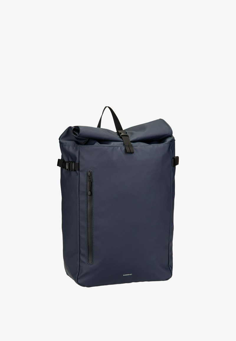 Navy roll-top backpack made of durable material, featuring a front zip pocket, adjustable straps, and minimalist design with smooth texture.