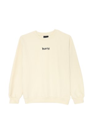 Maglione crema realizzato in tessuto morbido, con collo rotondo, maniche lunghe e un piccolo testo nero "DISCLAIMER" sul petto.