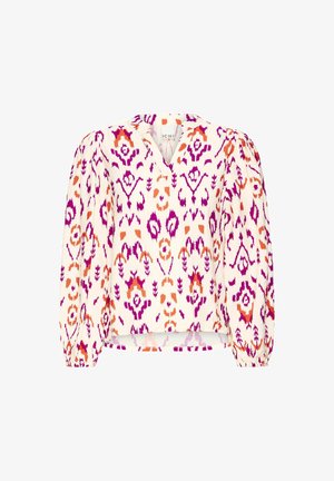 Balta palaidinė su ryškiu rožiniu, violetiniu ir oranžiniu ikat raštu. Turi V formos iškirptę ir pūstomis rankovėmis su elastingais rankogaliais, pasižymi laisvu siluetu.