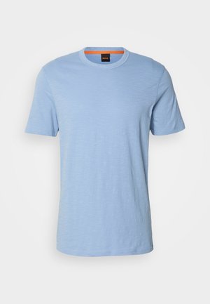 Light blue short-sleeve t-shirt made from soft cotton. Features a crew neckline and a subtle embossed logo on the chest.