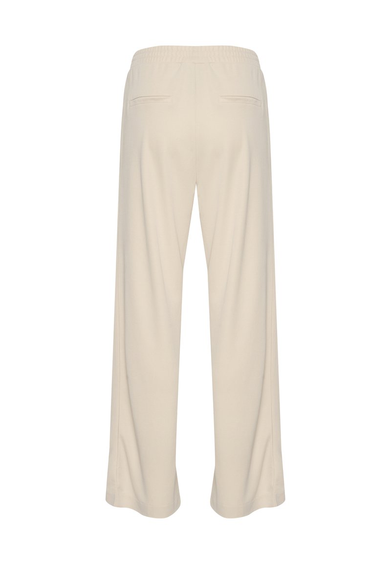 Beige weite Hosen mit elastischem Bund, ausgestattet mit zwei Gesäßtaschen und einer glatten Stoffstruktur. Einfaches Design in neutraler Farbe.