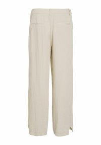 Beige wijde broek gemaakt van lichtgewicht stof. Heeft twee achterzakken en zijsplitten aan de zoom voor extra comfort.